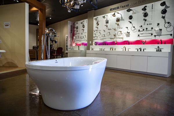 Free standing bathtub with Kohler fixtures in the background - Modern Supply Showroom
